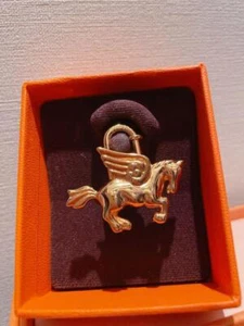 HERMES Gold Pegasus Cadena Lock for Hand Bag Charm Authentic With Box New RARE - Picture 1 of 6