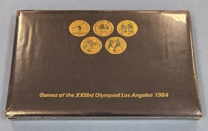 1984 Los Angeles Olympics Games Of The XXIIIrd Olympiad 24 Coin Set NIB - Picture 1 of 2