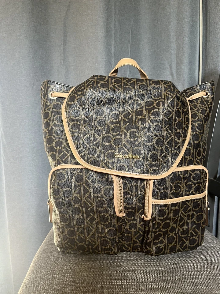 Calvin Klein Dark Brown Monogram Leather Adjustable Strap Outer Pocket Backpack - Image 1 of 4