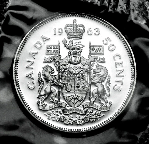 1963 50¢ silver proof like coin that will grade MS coin in a paper flip Cover