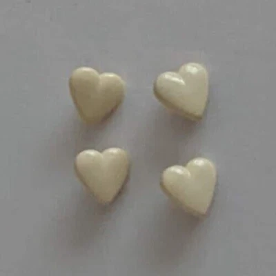 Four cream 14mm heart shaped shank buttons - Image 1 of 4