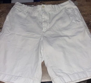 Pantalones cortos chinos IZOD marfil frente plano calce recto mezcla de algodón para hombre 36 - Imagen 1 de 4