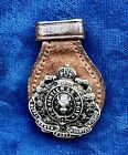 Canada undated early 20th century collar badge on leather hanger