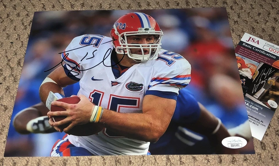 TIM TEBOW SIGNED 8X10 PHOTO AUTOGRAPH FLORIDA GATORS FOOTBALL JSA COA AUTO  - Image 1 of 1