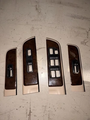 Interruptor de puerta Nissan Pathfinder 2001-2004 biseles bronceados grano de madera OEM 01-04 Foto 1 de 4