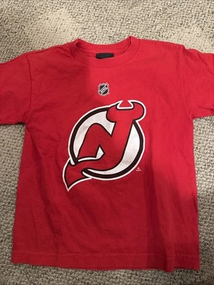 CAMISA REEBOK New Jersey Devils Zack PARISI 100% Algodón Roja Talla Juvenil PEQUEÑA Foto 1 de 4