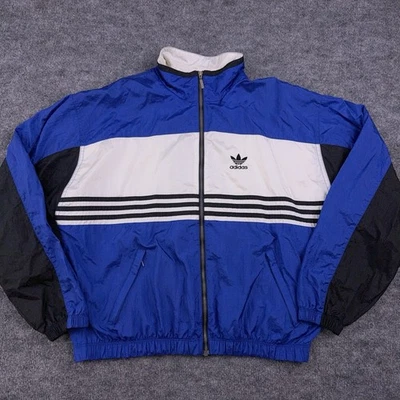 Chaqueta cortavientos vintage Adidas con cremallera bloques de color azul negro para mujer mediana Foto 1 de 4