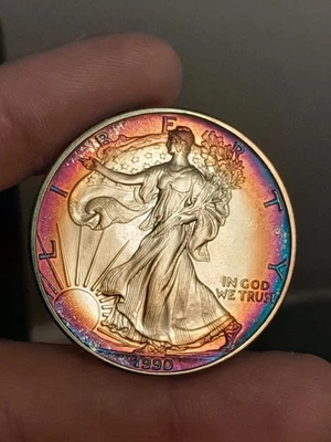 American Silver Eagle BU 1990 anverso tono arco iris. (De losa PCI antigua) Foto 1 de 4