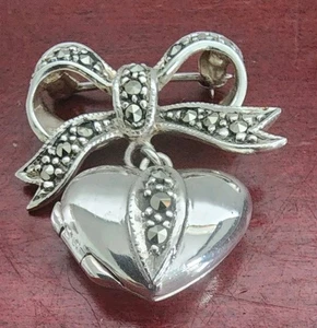 SU 925 PLATA ESTERLINA MARCASITAS ARCO CON MEDALLÓN CORAZÓN ENCANTO BROCHE. 12GRS - Imagen 1 de 10