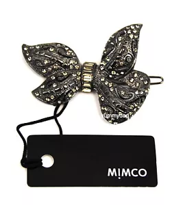 CLIP DE PELO MIMCO DANDY ARCO EN CRISTAL A REACCIÓN NUEVO CON ETIQUETAS PRECIO DE VENTA SUGERIDO POR EL FABRICANTE $59.95 - Imagen 1 de 2