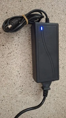 AC/DC Adapter Model LX-1205 Laptop Charger with cord and power on light - Image 1 of 2