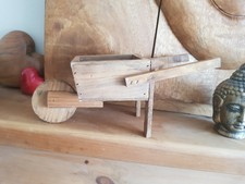 Wood wheelbarrow plant holder 