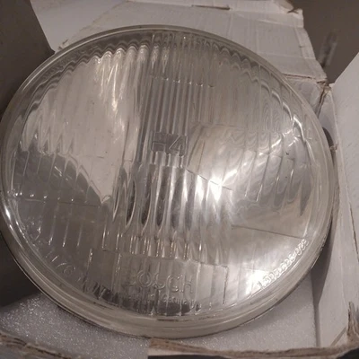 BOSCH Conjunto Faro Moto H4 7" Parte # 301 600 118  Foto 1 de 4