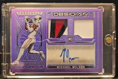 MICHAEL WILSON RPA, ARIZONA CARDINALS, 2023 PANINI OBSIDIAN,  PURPLE  /30 - Image 1 of 3