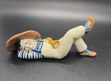Ceramic Sleeping Asian figurine Brown Hat holding Trumpet