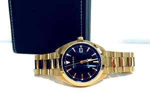 RELOJ SUIZO MOVADO Heritage datron 3650143 esfera azul fecha ip dorado 39 mm $1095 - Imagen 1 de 18