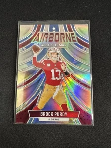 2024 Panini Rookies & Stars - Airborne Brock Purdy #A-BPY Silver - Bild 1 von 2