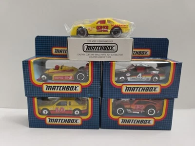 4 Matchbox Grid Blue Box Racing Cars (ALL SEALED) W/Bonus Toy Fair Car - Image 1 of 4