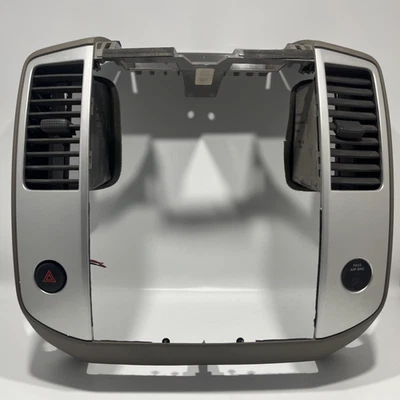 Nissan Frontier Xterra Pathfinder 2009-2012 tablero central bisel C Desert fabricante de equipos originales usado Foto 1 de 4