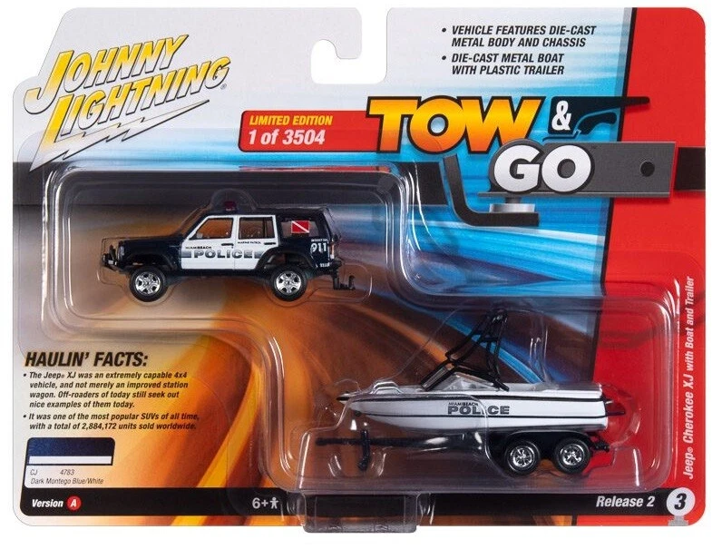 1/64 MIAMI BEACH POLICE 1988 JEEP CHEROKEE W/BOAT & TRAILER JLBT018 SET A - Image 1 of 1