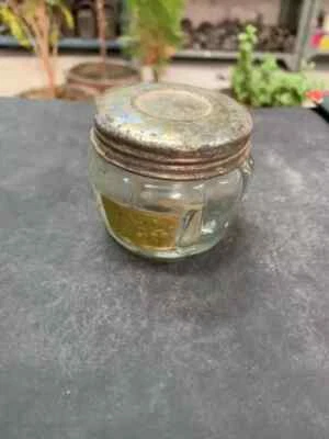 Frasco vazio vintage antigo de vidro transparente com tampa de lata colecionável - Imagem 1 de 4