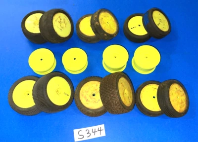 R/C TEAM LOSI BUGGY TIRES & RIMS GLUED ALL USED STILL USEABLE OTHER TIRES DONE - Image 1 of 4