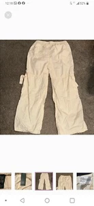 These Women's Mid-Rise Wide Leg Cargo Pants in Off-White by Wild Fable are... - Picture 1 of 8