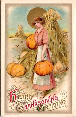Postal de Acción de Gracias de 1910 joven dama delantal blanco llevando calabazas del campo Foto 1 de 2