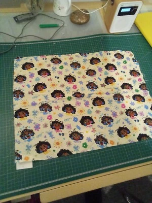 Polycotton fabric. Pale Yellow. with colourful dolls heads. 40x56cms - Image 1 of 4