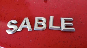 2008 2009 MERCURY SABLE REAR SILVER EMBLEM LOGO NAMEPLATE OEM 2008 - Picture 1 of 1