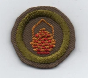Insignia de mérito de canasta, tipo C bronceado estrecho prensado (1936-46), usada - Imagen 1 de 1