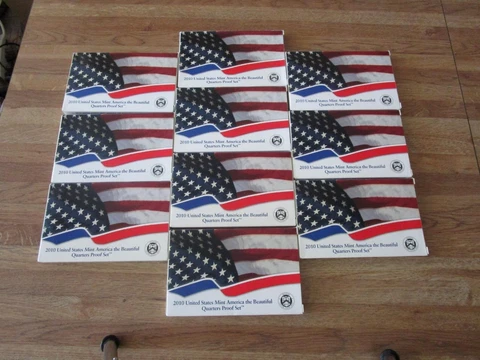Lot of 10 2010 ATB Quarter Proof Sets Cover