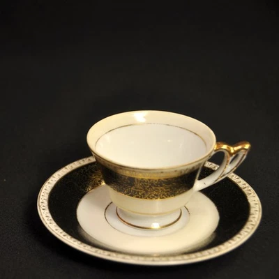 UCAGCO Demitasse Cup & Saucer Occupied Japan 1946-1952 Black Cream w/Gold Floral - Image 1 of 4