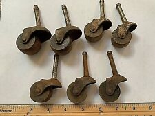 Lot of 7 Antique Victorian Cast Iron Furniture Castors with wooden Wheels 