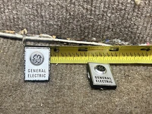 Pair GE Audio Replacement Parts: Plastic Silver Black Badge/Logo Set Of 2 Lot - Picture 1 of 4
