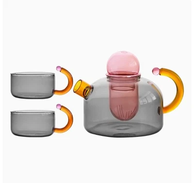 Tetera de vidrio resistente al calor de color distintivo con filtro de separación de agua de té Foto 1 de 2