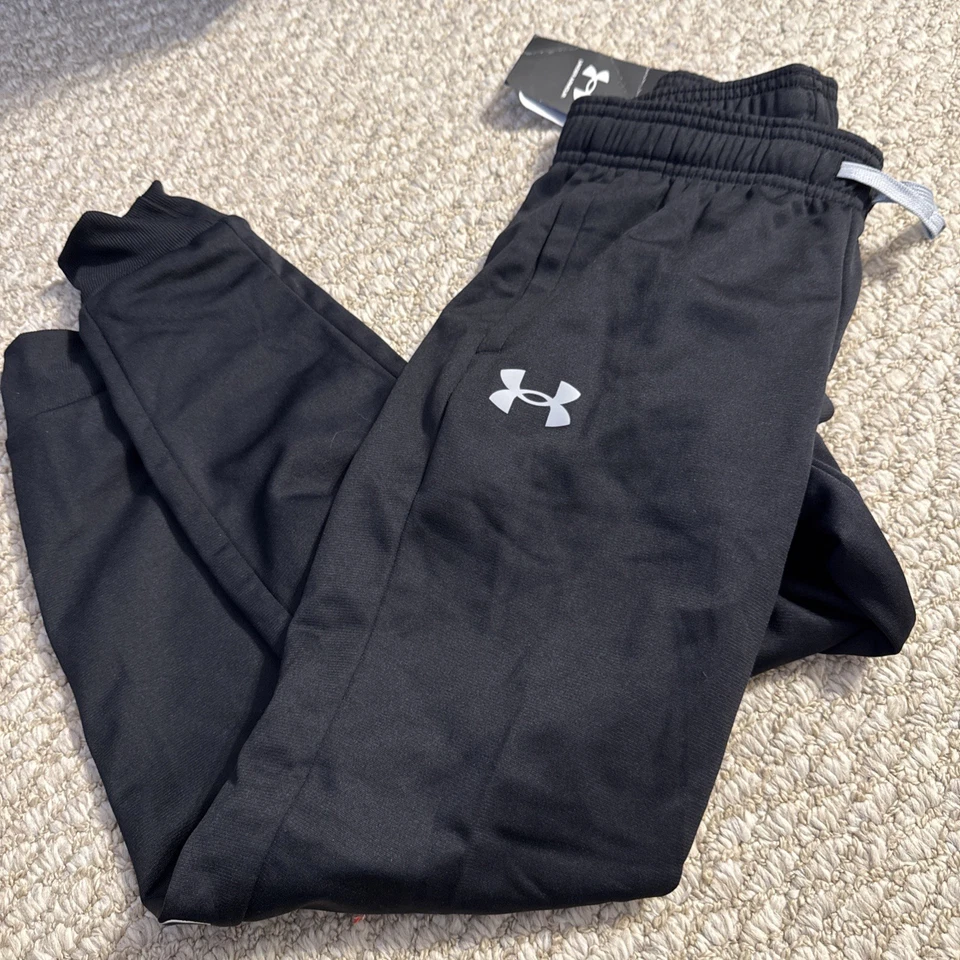 Pantalones cónicos Under Armour Pitch gris/negro UA Brawler 2.0 jóvenes pequeños Foto 1 de 4