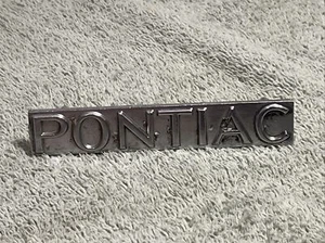 Silver Pontiac 76-77 Grill Plate 498834    C1 - Picture 1 of 6