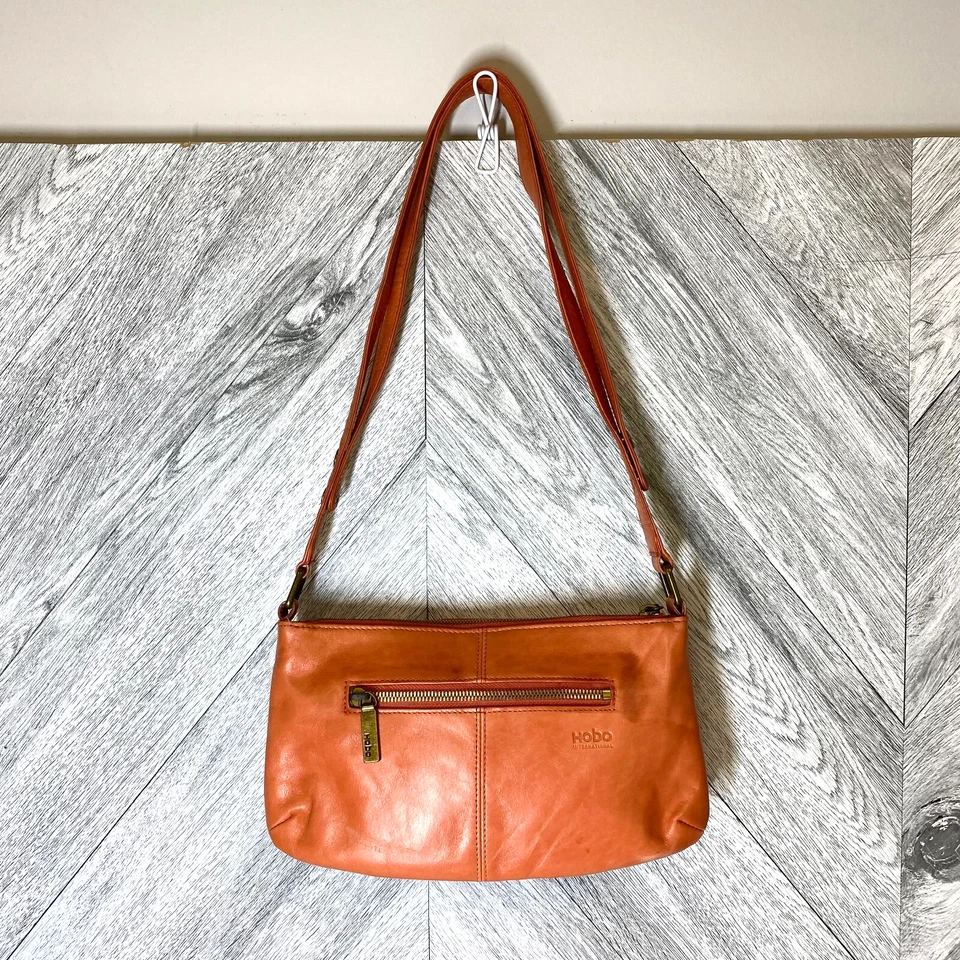 Bolso de hombro Hobo International para mujer de cuero naranja quemado con correa a presión con cremallera superior S Foto 1 de 4