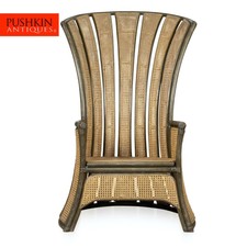 AN UNUSUAL MID 20TH CENTURY "PEACOCK" HIGH CHAIR IN BAMBOO AND RATTAN