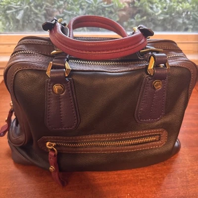 Oryany precioso bolso de cuero marrón negro con detalles ciruela y burdeos.  Foto 1 de 4