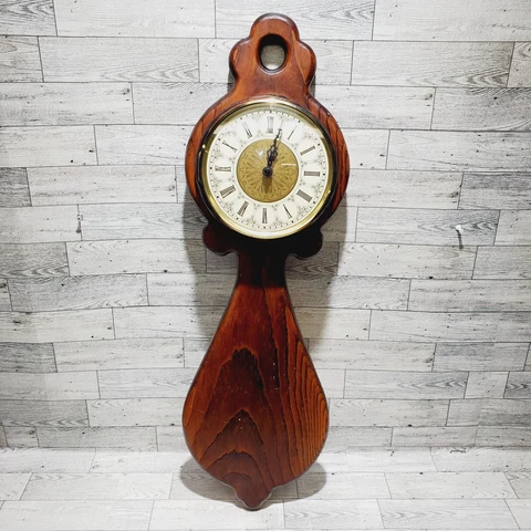 Clock Made on Earth, Inc Tall Carved Wood Wall Clock Battery Operated USA Cover