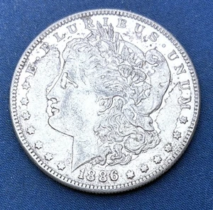 1886 Morgan Silver Dollar - Picture 1 of 2