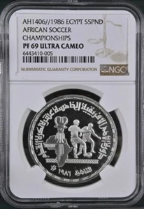 EGYPT , 5 POUNDS AFRICAN FOOTBALL CHAMPIONSHIP- CAIRO 1986 NGC PF 69 UC , RAREW - Picture 1 of 2