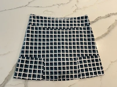 Skort de golfe Golftini quadriculado casa de tijolos plissado desempenho tamanho 4 - Imagem 1 de 4