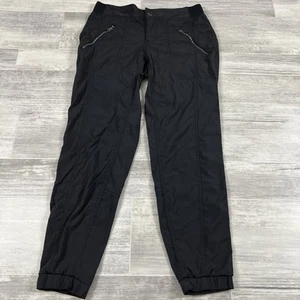 Pantalón de chándal corto Athleta Trekkie para mujer talla 4 negro bolsillos con cremallera puños # 67598 - Imagen 1 de 8