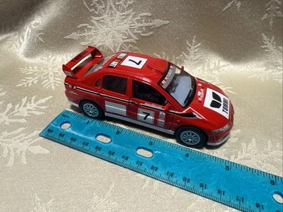 Puertas de apertura fundidas a presión Kinsmart Mitsubishi Lancer Evolution VII 1:36 Foto 1 de 4