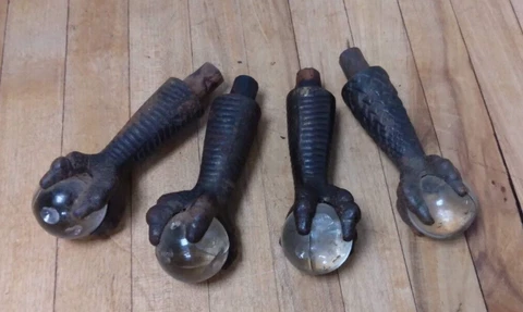 Set of Four Vintage Cast Iron and Glass Eagle Claw Table Leg Feet Cover