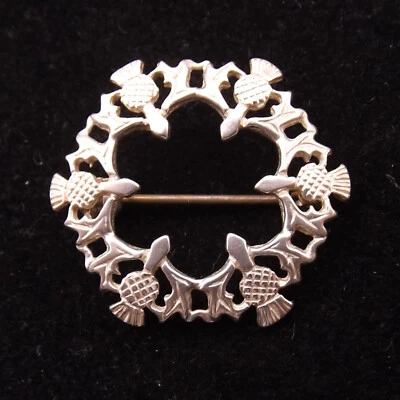 STERLING SILVER BROOCH by Ortak a circle of Scottish Thistles - Image 1 of 4