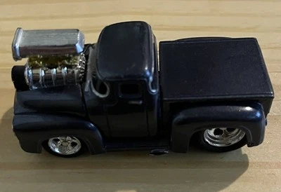 Funline 2001  Muscle Machines  Rubber Tires  Die-Cast Ford Black Toned Truck - Image 1 of 4